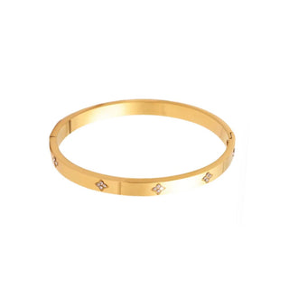Gold bracelet with small diamonds on a white background