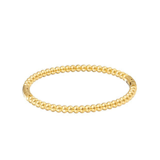 Gold beaded bracelet on a white background